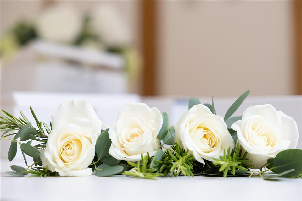 Classic white rose and greenery buttonholes
